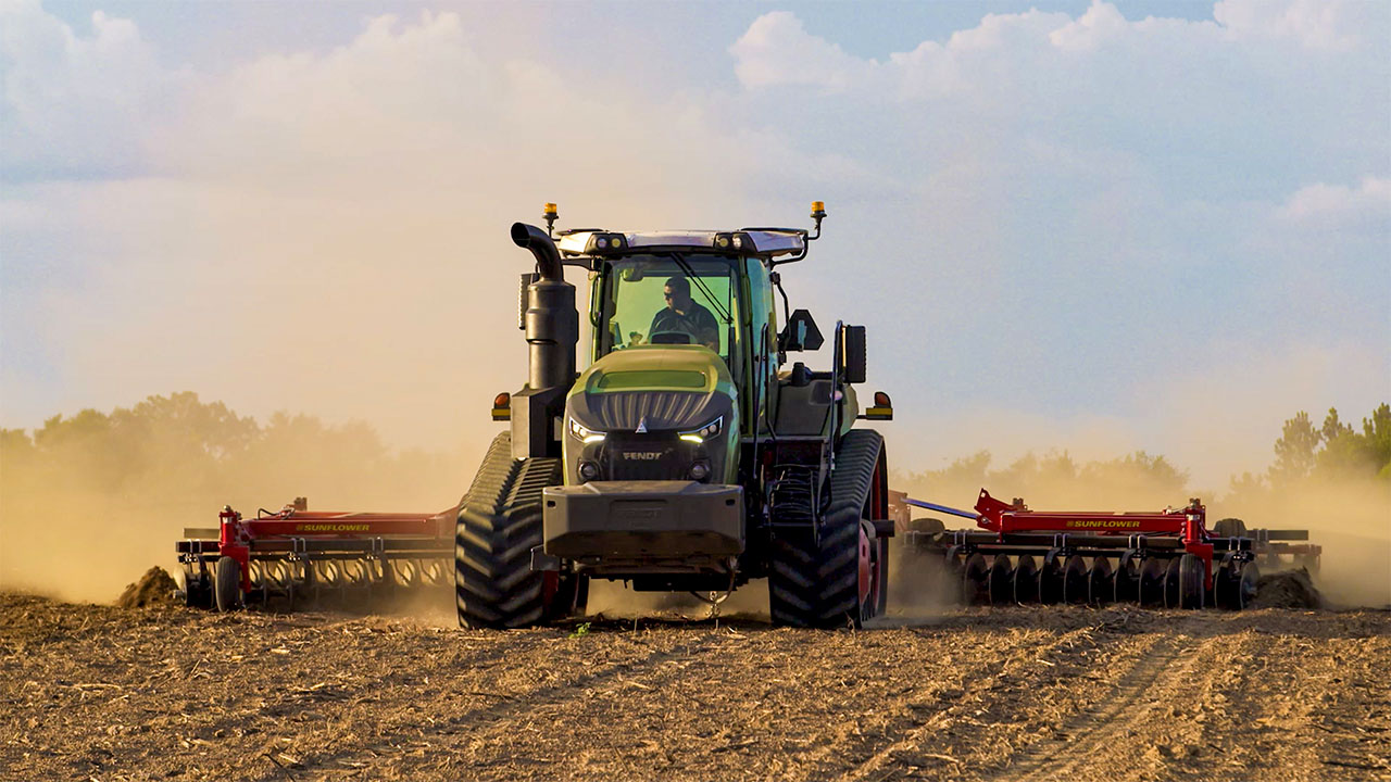 Fendt 1100 Vario MT tractor with tracks working a dusty field, showcasing high-power tillage and precision farming performance.