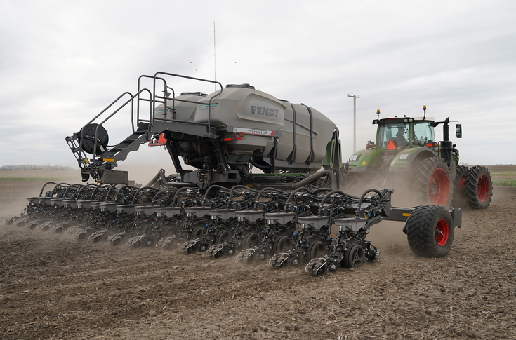 Fendt Momentum planter with Fendt tractor and seed tender operating in open field during spring planting season.