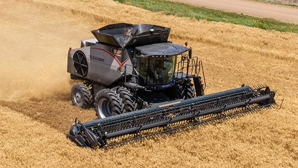 Gleaner 9300 Series grain head harvesting wheat with precision, mounted on Gleaner S9 combine for high-capacity field performance.