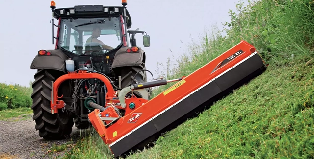Kuhn TBE 22 offset mower performing road maintenance.