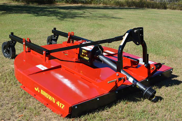 Brown 417 rotary cutter attachment shown on grass, built for tough cutting conditions.