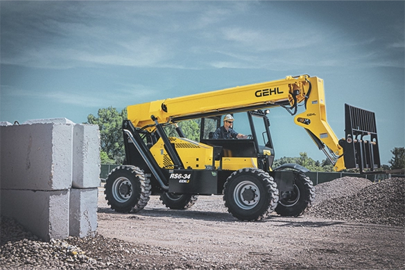 Gehl RS6-34 telescopic handler lifting a pallet at a job site, emphasizing its extended reach and rugged construction for material handling tasks.