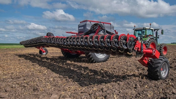Extended rear view of HORSCH Avatar seeder in operation, showing multiple seeding rows and heavy-duty disc openers across cultivated soil.