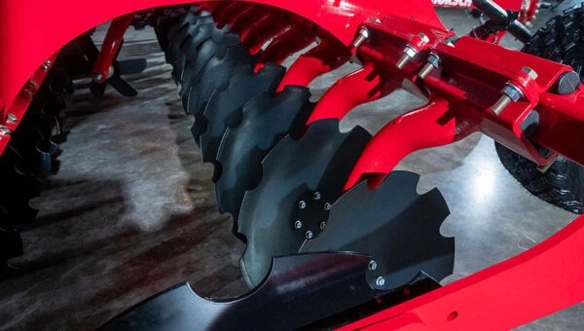 Close-up view of serrated concave discs on the HORSCH Joker HD tillage tool, engineered for aggressive residue incorporation and long-term durability.