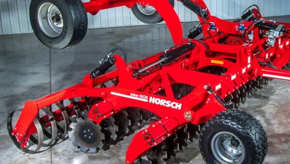 HORSCH Joker RX 820 high-speed disc cultivator in storage, highlighting robust construction, dual wheels, and precision disc alignment.