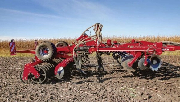 HORSCH Tiger MT cultivator in a field, highlighting deep tillage tines and disc harrows designed for aggressive soil mixing and residue incorporation.