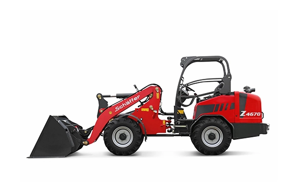 Side view of the Schäffer 4670Z wheel loader showcasing compact design, Z-kinematics lifting arm, and front bucket attachment.
