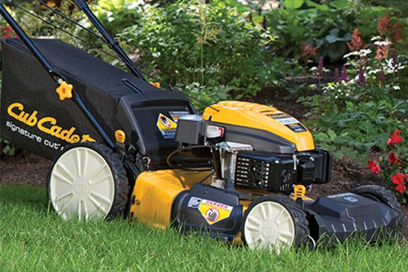 Close-up of a Cub Cadet self-propelled walk-behind mower on grass