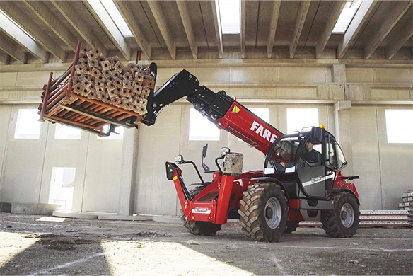 Faresin Big Range telehandler lifting a heavy industrial container at a construction site, optimized for high-reach applications.