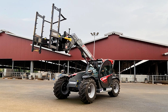 Faresin Compact Series telehandler with hay stack attachment, designed for agile work in agricultural settings.