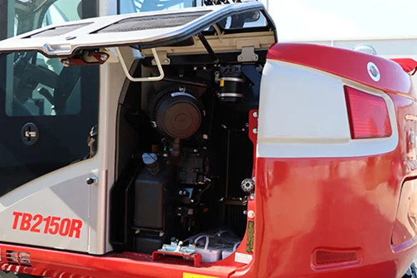 Open engine bay of the Takeuchi TB2150R excavator showcasing easy-access maintenance design.