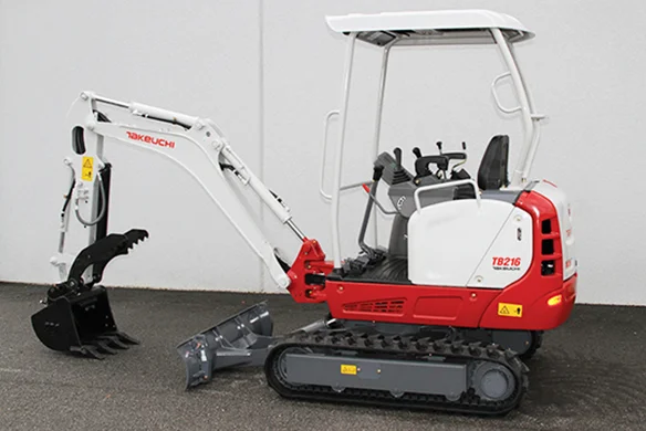 Compact Takeuchi TB216 mini excavator with open cab, shown on pavement ready for landscaping or utility work.