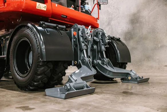Side profile of Takeuchi TB395W with engine compartment open, showcasing internal components.