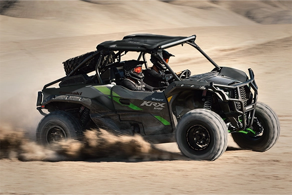 Kawasaki Teryx KRX 1000 kicking up sand while racing across the desert