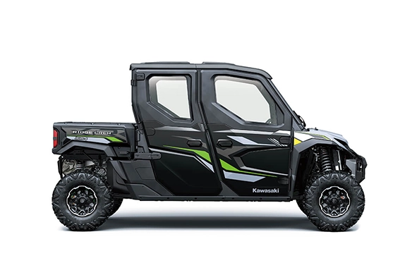 Side view of a Kawasaki Ridge XR Crew in black and green, showcasing its full doors, large wheels, and four-door configuration on a white background.