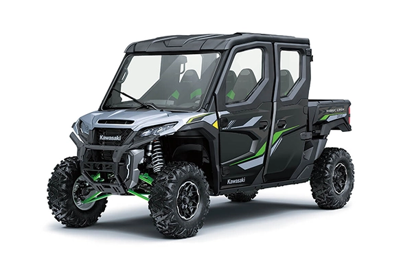 Front three-quarter view of a Kawasaki Ridge XR Crew with aggressive styling, silver hood, and black-green accents, displayed on a white background.