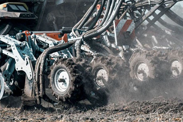 Close-up view of planting ag equipment with PTx Planting & Seeding solutions.