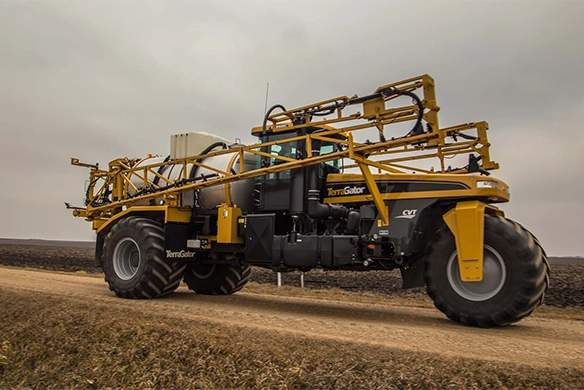TerraGator applicator traveling at road speed through farmland
