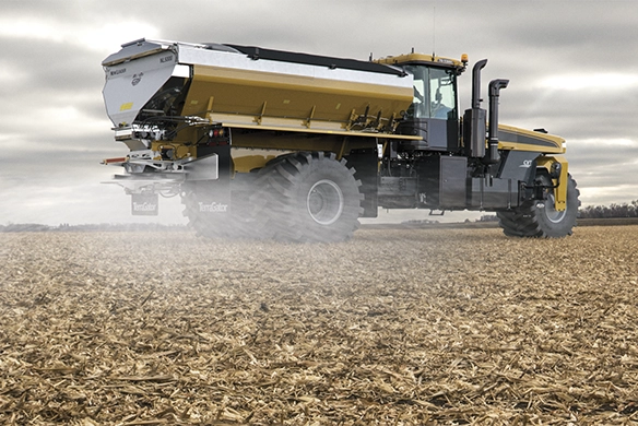 TerraGator applicator spreading liquid fertilizer across a cornfield