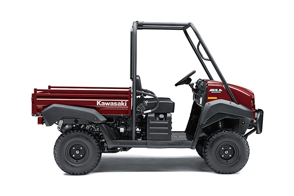 Side view of a red Kawasaki Mule 4000 utility vehicle with open cabin and rugged tires, isolated on a white background.
