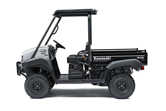 Side profile of a grey Kawasaki Mule 4010 4x4 FE utility vehicle, highlighting its rugged frame and compact build.