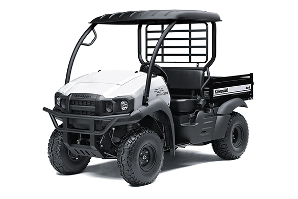 Front angled view of a white Kawasaki Mule SX 4x4 FE with a black roof, rugged tires and utility bed.