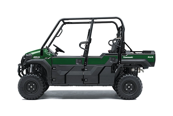 Side profile of a green Kawasaki Mule PRO-FXT 820 4x4 with extended cab and rugged utility bed, isolated on white background.