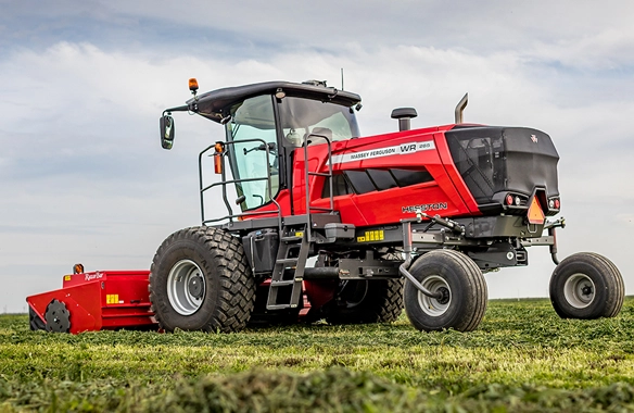 Hesston by Massey Ferguson WR Series self-propelled windrower in the field, showcasing advanced hay and forage equipment.