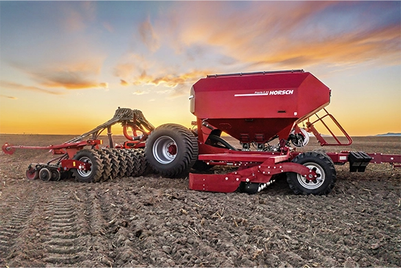 Horsch air seeder and tillage unit working at sunset, preparing the field with precision and high capacity.