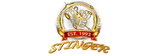Stinger Inc. logo with gold laurel crest and “Est. 1992” badge, representing the brand’s heritage in hay equipment