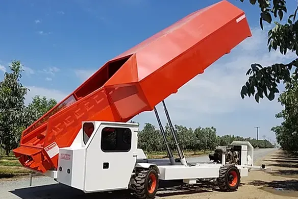 Weldcraft Industries bank out wagon with hydraulic lift bin, designed for high-capacity nut harvesting and field transport efficiency.