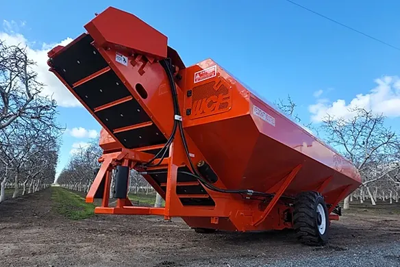 Weldcraft Industries bulk trailer with rear discharge conveyor, built for hauling and unloading harvested almonds, walnuts, and pistachios.