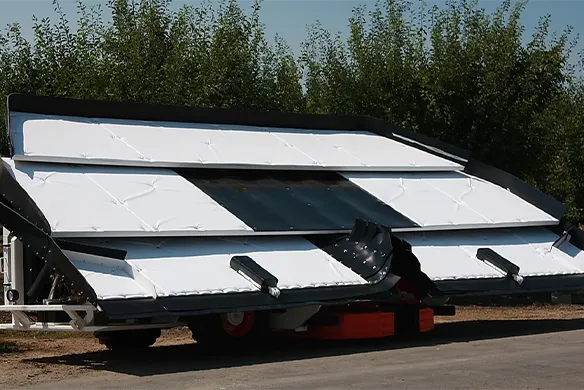 Weldcraft Industries side-by-side shaker with wide coverage paddles, built to maximize nut drop efficiency during orchard harvest.