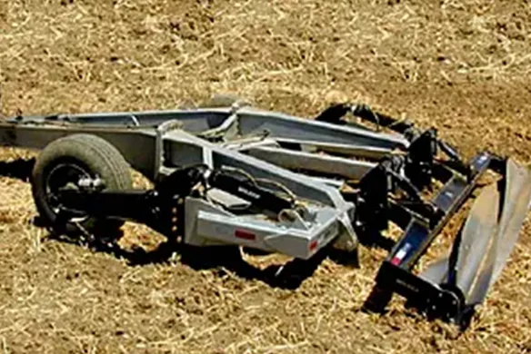 Wilcox 3000 Series pull-type chisel equipped with heavy-duty frame and hydraulic lift, ideal for aggressive soil fracturing and residue management.
