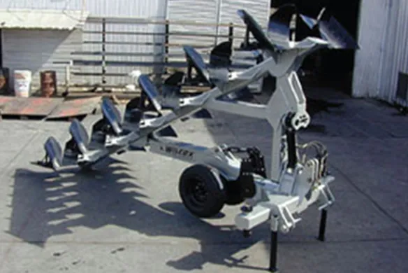 Wilcox HD full-mount plow with multiple bottom moldboards on display, designed for heavy-duty tillage and deep soil penetration in commercial farming.