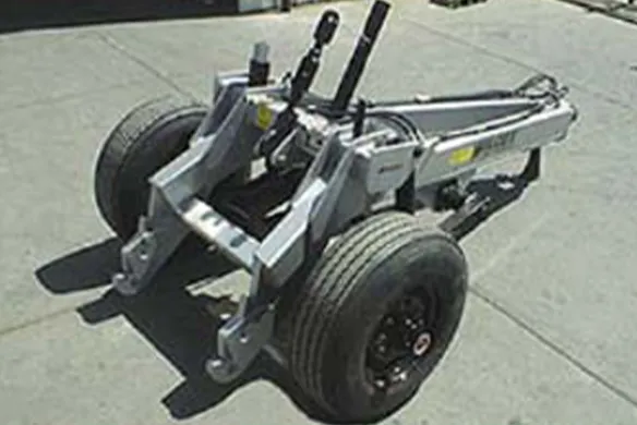 Wilcox heavy-duty hitch carrier with dual wheels and hydraulic connections, designed for transporting and operating large tillage implements.