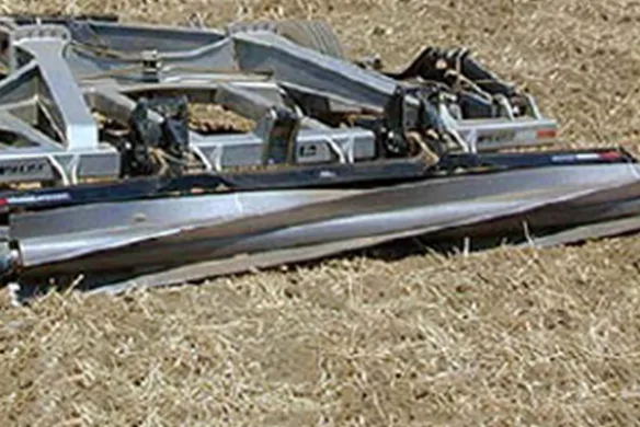 Wilcox spiral crumbler mounted on finishing implement in field, optimizing soil tilth and residue incorporation for planting efficiency.