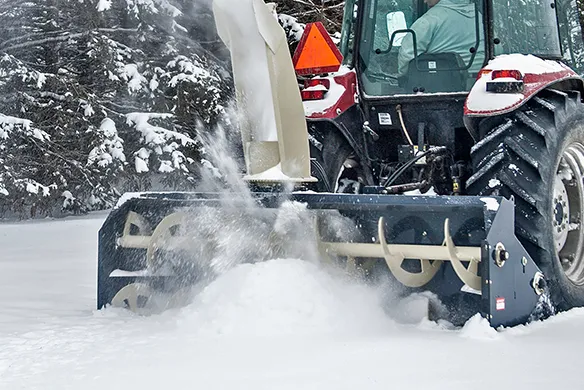 Front view of a Farm King Allied snowblower showing high-capacity auger system moving heavy snow efficiently
