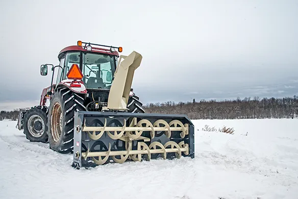 Front view of a Farm King Allied snowblower featuring a wide intake and dual auger design for efficient snow handling