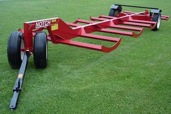 Notch MFG bale transporter on display on a green, grass field.