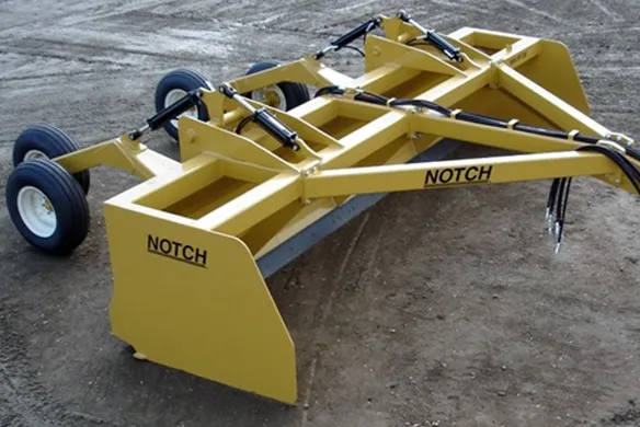 Notch MFG land leveler on display on a wet dirt road.