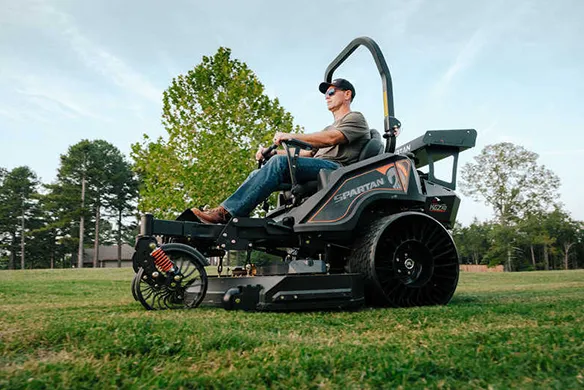 Side profile of a Spartan KGZ-XD zero-turn mower delivering commercial-grade performance on open grass areas