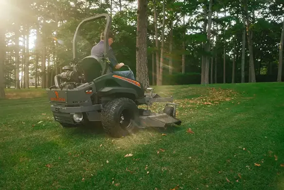 Spartan RT-HD zero-turn mower operating on an open lawn, delivering stable traction and powerful performance