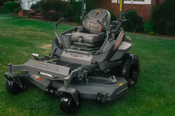Front quarter view of a Spartan RT-HD zero-turn mower featuring a wide cutting deck and comfortable operator seat