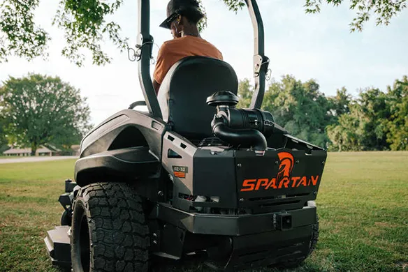 Rear view of a Spartan RZ-HD Blackout zero-turn mower showing wide rear tires and heavy-duty construction
