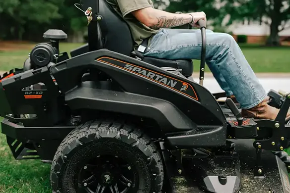 Side profile of a Spartan RZ-HD Blackout zero-turn mower designed for strength, stability, and performance mowing