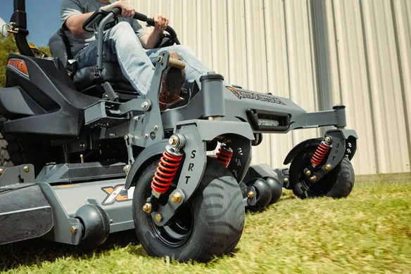 Front wheel and suspension system on a Spartan SRT-XD zero-turn mower designed to improve ride comfort and stability