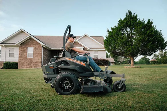Side view of a Spartan SRT-XDe zero-turn mower delivering premium comfort and control on large residential lawns