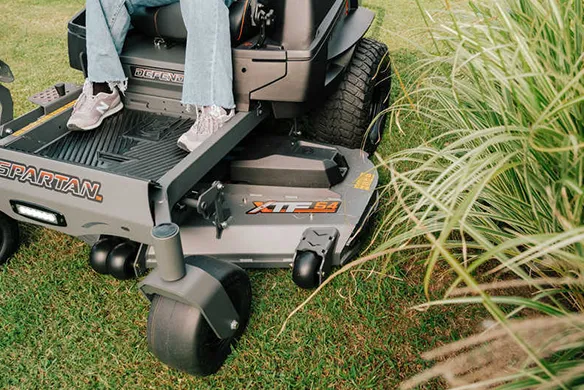 Spartan Defender zero-turn mower cutting deck designed for precise trimming around landscaping and obstacles