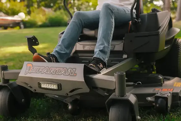 Front cutting deck and operator platform on a Spartan Shield HD zero-turn mower designed for smooth residential mowing